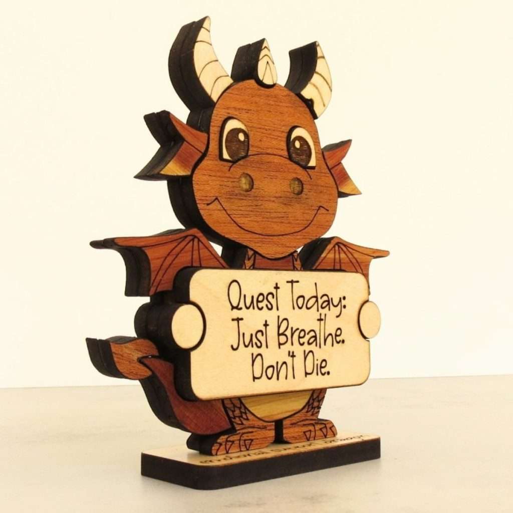 Side view of layered hardwood emotional support dragon showing wood species detail and base depth.