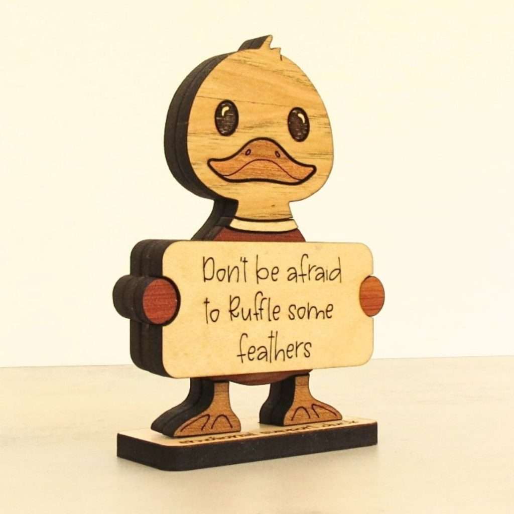 Angled view of layered hardwood emotional support duck showing wood species detail and construction