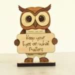 Handcrafted hardwood emotional support owl desk pet holding sign that reads Keep Your Eyes on What Matters