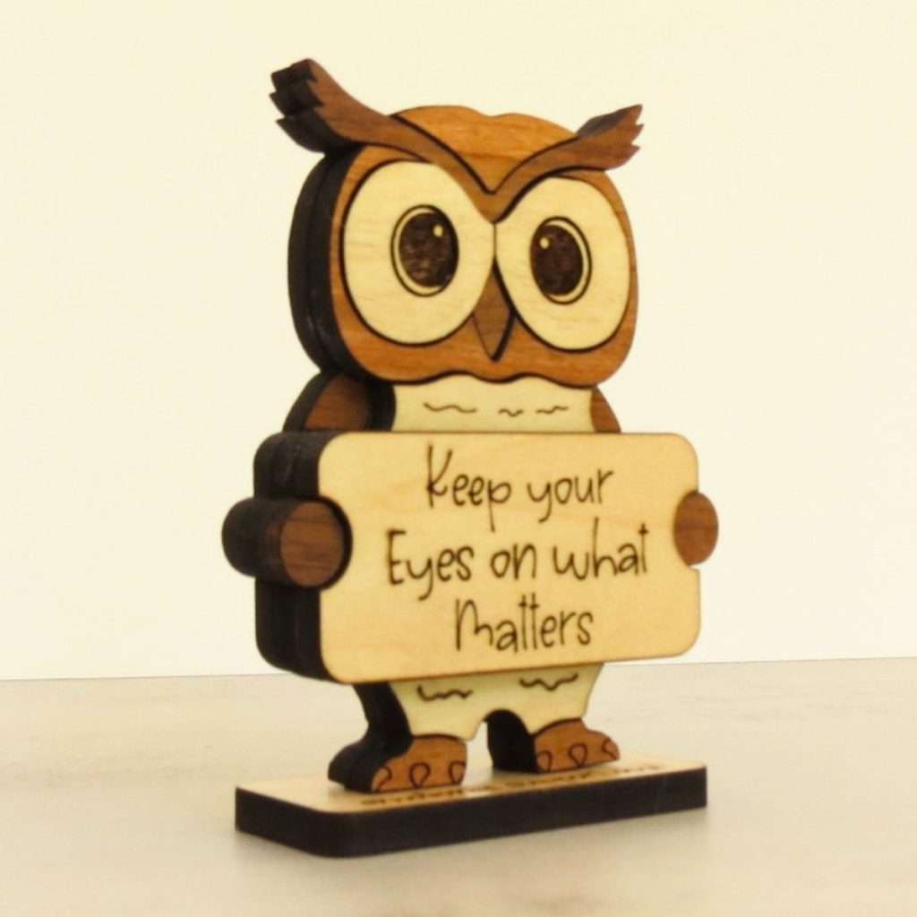 Angled view of layered hardwood emotional support owl showing wood species detail and construction