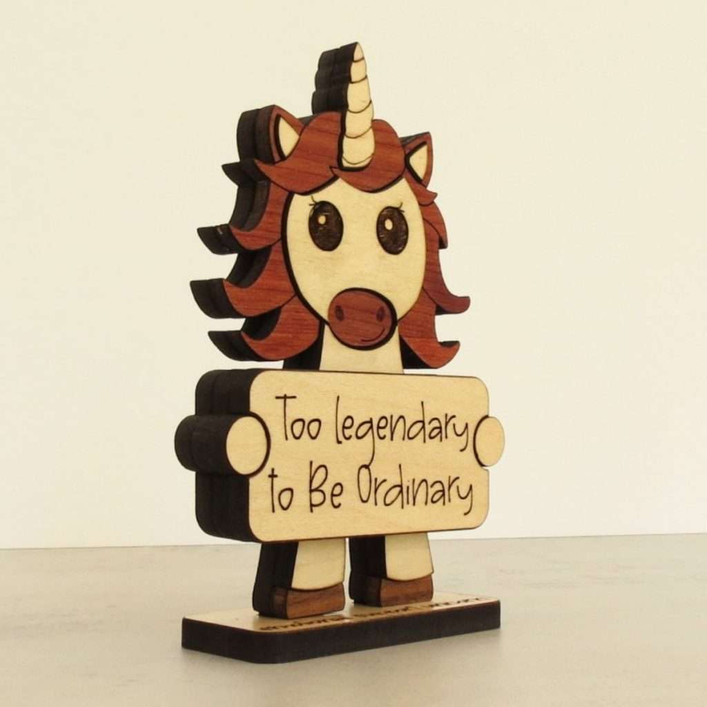 Angled view of layered hardwood emotional support unicorn showing wood species detail and construction