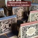 Group photo of book valet front design options and labeled that these can be found in our Book Lover Collection. It shows the monogram front, a few options on the engraved front and the dark and light stains in use.