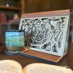 Styled lifestyle image of the light wood version of the Rose design front book valet.